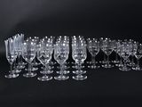 a lot of empty wine glasses on a black background