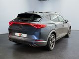 the rear end of a grey suv parked in a showroom