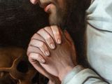 painting of a man with a beard and a skull on a table