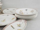many plates and cups that are sitting on a table