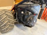 a tractor that is parked in a garage