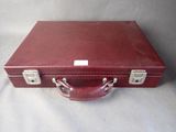 a red suitcase that is sitting on a table