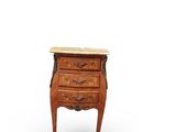 a small wooden chest of drawers with marble top