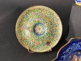two plates and a bowl are sitting on a table