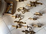 a lot of brass objects on the floor in the room