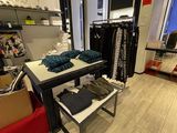 an image of a clothing store with a lot of clothes