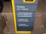 a cardboard box with a sign on it that says kodak