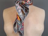 a close up of a mannequin torso with a scarf on it