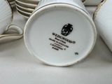 a stack of cups and saucers sitting on a table