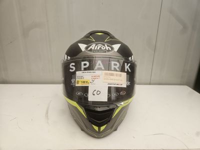 a close up of a helmet on a table with a tag