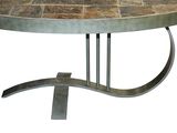 a round table with a metal base and a tile top