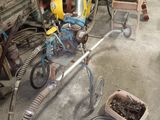 a small child ' s bike that is parked in a garage