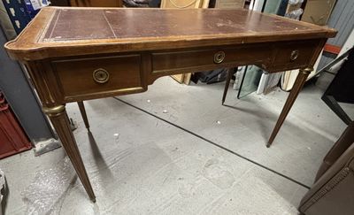a wooden desk with two drawers on it in a room