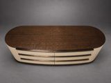 an oval coffee table with a woven top and two drawers