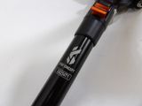a close up of a bike handle on a white surface