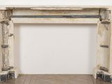 a white marble fireplace with a shelf on top of it