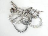 many different types of pearls on a white surface