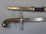 two knives that are laying on a table
