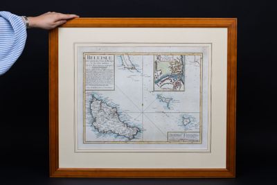 an old map of the british isles is displayed in a wooden frame