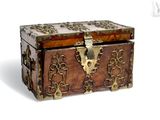 a small wooden box with a lock on top of it