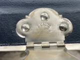 a close up of a metal latch on a suitcase