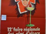 a red poster with a woman holding a glass of wine