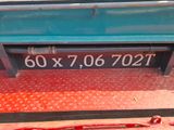 a sign on the side of a bus that says 60x7, 06707