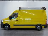 the yellow van is parked in a large room with a ladder on the roof