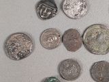 a lot of coins that are sitting on a table
