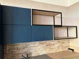 a picture of a kitchen with blue cabinets and a sink