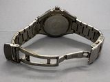 an image of a close up of a wrist watch on a table