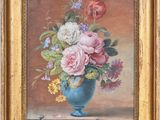 painting of flowers in a blue vase on a table in a gold frame
