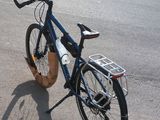a bicycle that is parked on the side of the road