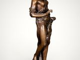 a bronze statue of a woman holding a book