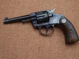 a gun that is on the ground on a brown surface