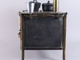 a small stove with pots and pans on top of it