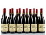 six bottles of red wine lined up in a row