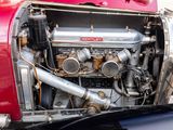 a close up of a red car with a engine in it