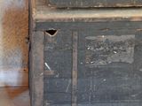 an old wooden chest sitting in the corner of a room