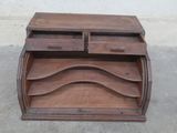 a wooden desk with a drawer on top of it
