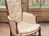 a chair that is sitting in front of a window