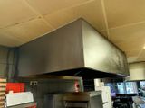 an image of a commercial kitchen with a stove and oven