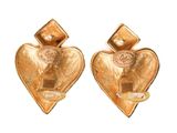 pair of gold heart shaped earrings with pearls on a white background