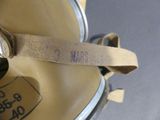 a close up of a watch on a strap attached to a backpack