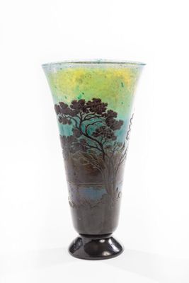 a glass vase with a painting of a tree on it