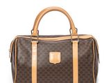 a brown and tan handbag on a white background