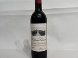 a bottle of wine that is sitting on a table