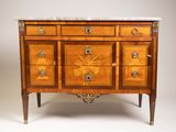 an antique wooden chest of drawers with marble top