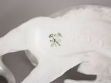 porcelain figurine of a horse with a rider on it ' s back
