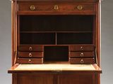 an antique wooden desk with drawers and a marble top